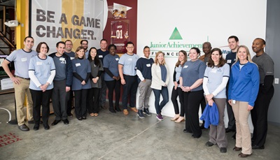 Host employees volunteer with Junior Achievement to help students  learn about fiscal responsibility.