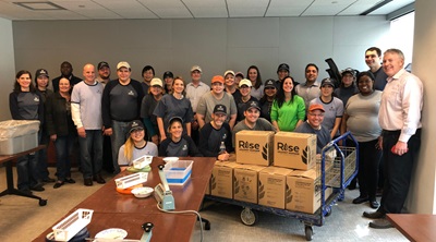 Employees assembled meals for Rise Against Hunger