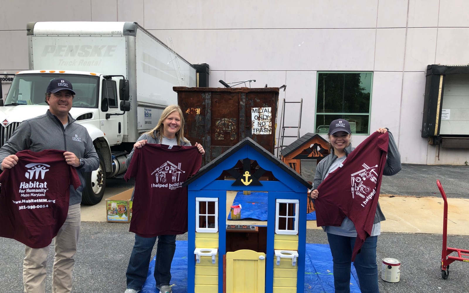 Volunteers construct and paint children’s playhouses that are donated to local Habitat families